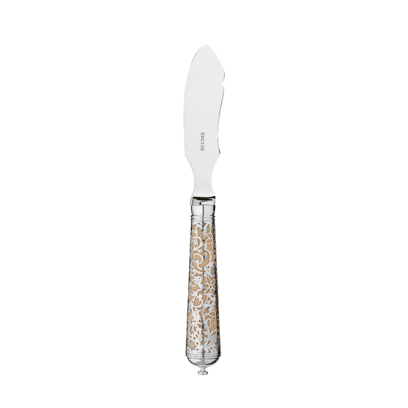 L’Insolent Ivory butter serving knife fully in sterling silver with arabesque handle on table.
