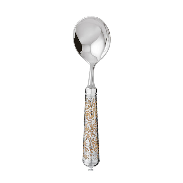 L’Insolent Ivory bouillon spoon fully in sterling silver with arabesque handle on elegant table.
