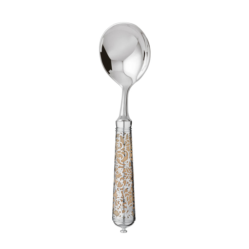 L’Insolent Ivory bouillon spoon fully in sterling silver with arabesque handle on elegant table.