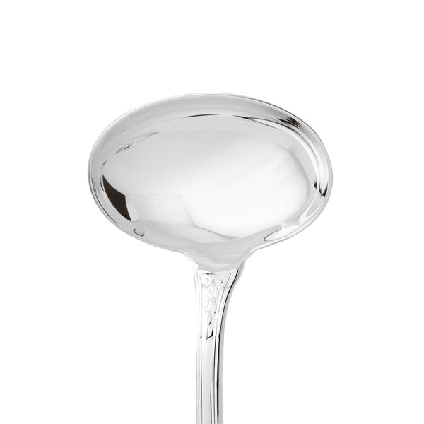 Gravy ladle silver plated with deep bowl and laurel motif handle close-up on the wide bowl.