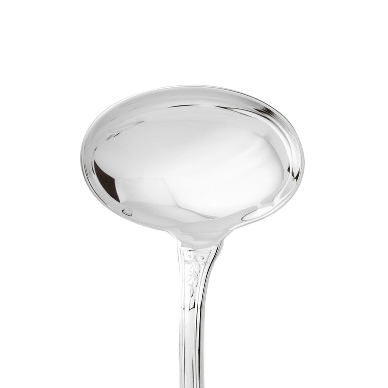 Gravy ladle silver plated with deep bowl and laurel motif handle close-up on the wide bowl.