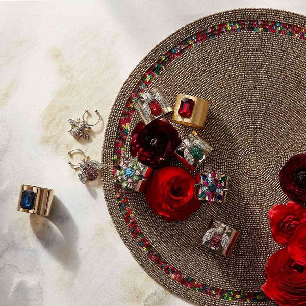 Joanna Buchanan napkin rings styled together, including navy blue Single Gem ring