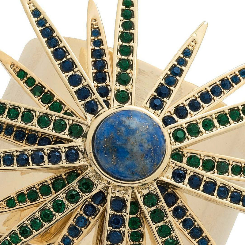 Close-up of Joanna Buchanan’s Starburst Napkin Ring with deep blue lapis lazuli center