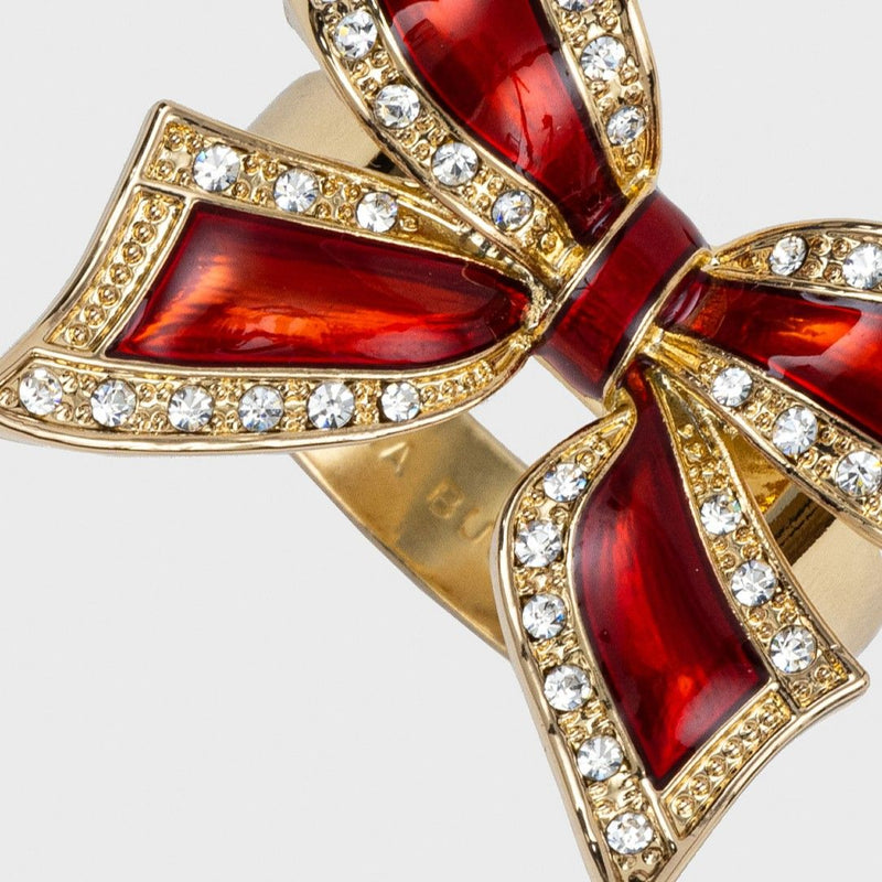 Close-up of red bow napkin ring by Joanna Buchanan with enamel finish