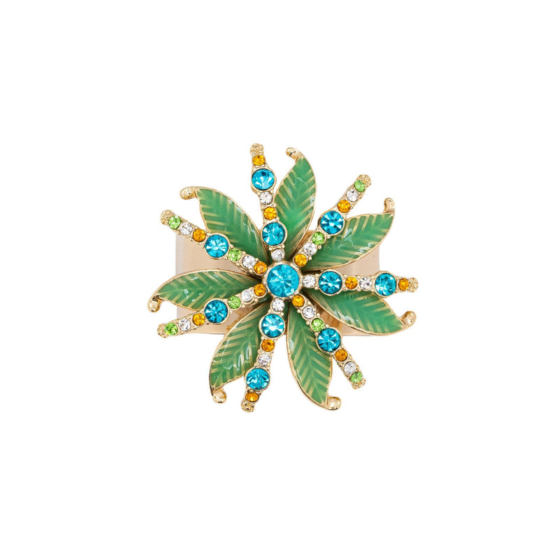 Close-up palm tree and coloured crystals on napkin ring by Joanna Buchanan.