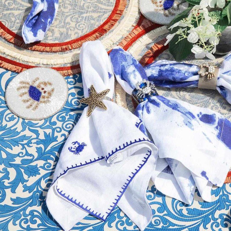 Starfish Napkin Ring by Joanna Buchanan in coastal table setting with white and blue tones and marine-inspired décor