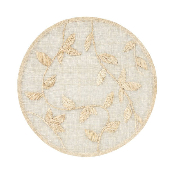 Natural palm frond round placemat with straw-like texture by Joanna Buchanan.