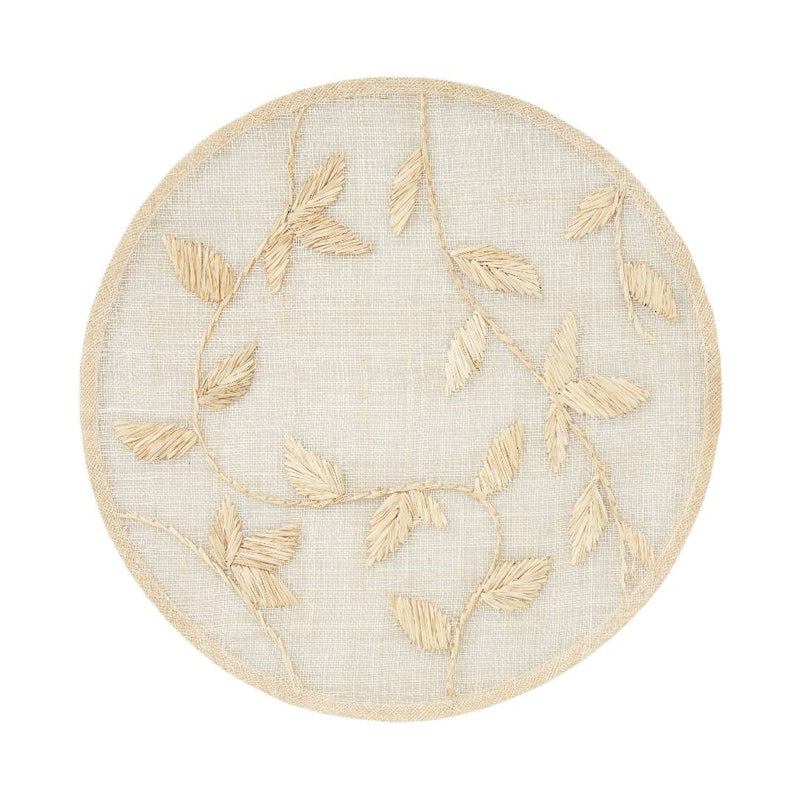 Natural palm frond round placemat with straw-like texture by Joanna Buchanan.