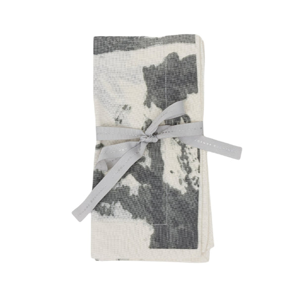 Set of two Grey Brushstroke napkins by Joanna Buchanan folded on white background.