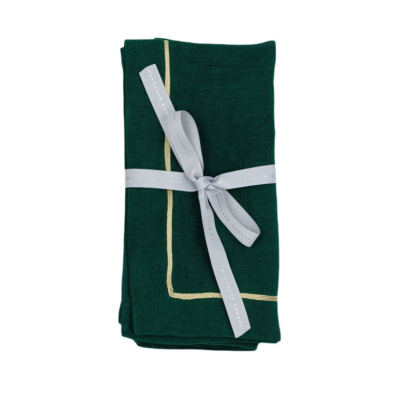 Hunter green linen napkin with gold trim folded on white background, sold at Amiramour.