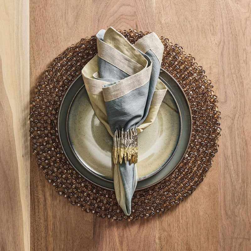 Refined tablescape with Patina Napkin Ring by Kim Seybert in warm brown and grey décor
