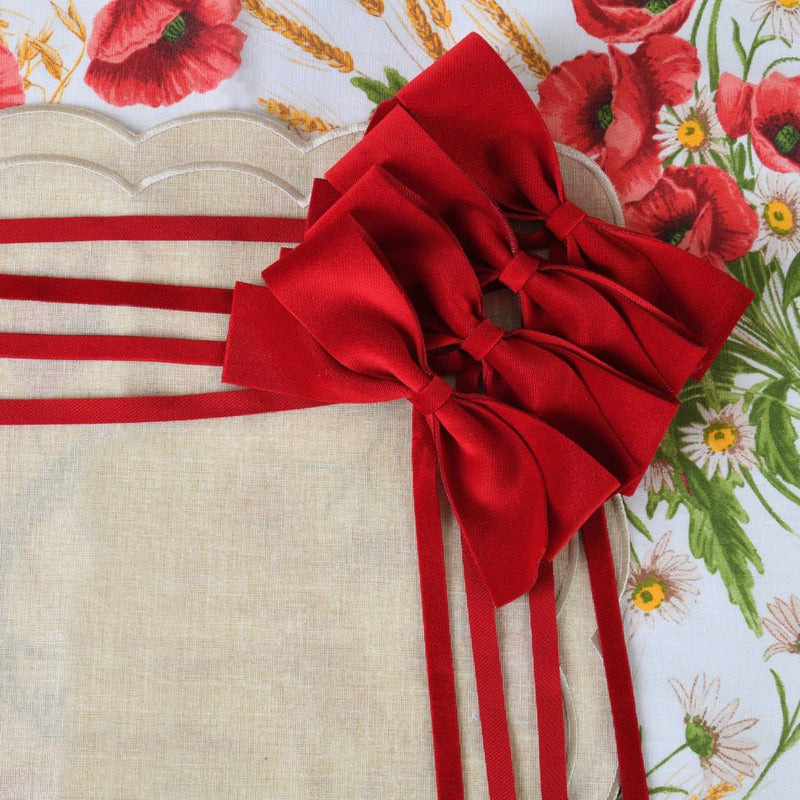 Close-up of red velvet bow by Roseberry Home, sold by Amiramour