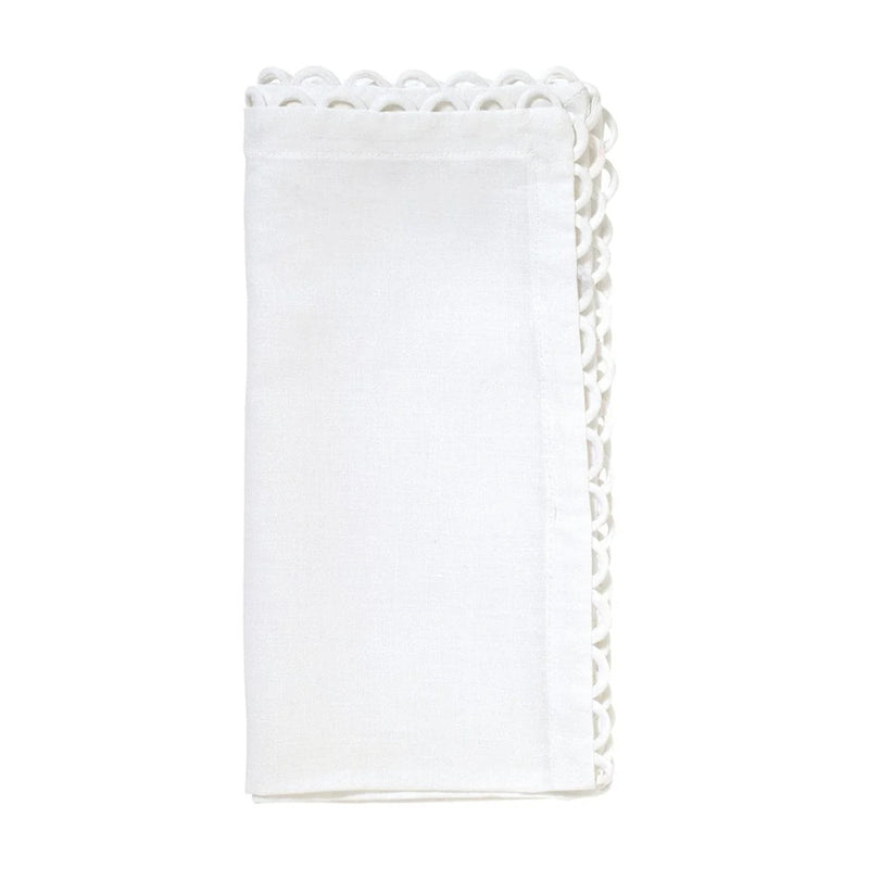 White linen napkins by Kim Seybert, featuring delicate looped edges