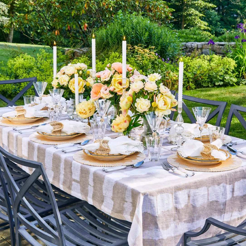 Loop Edge white napkins by Kim Seybert, styled on outdoor tablescape