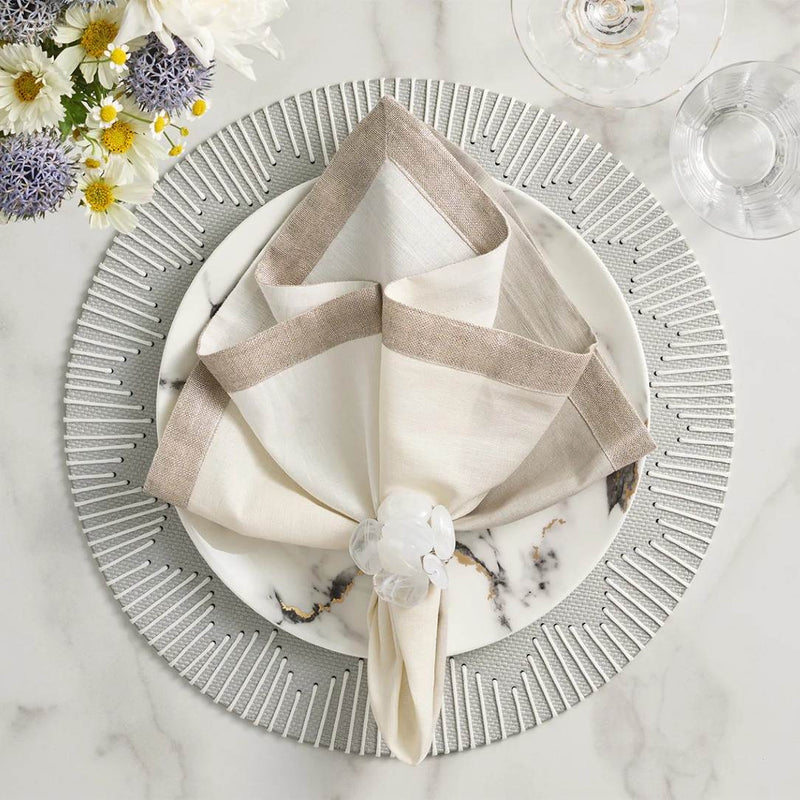 Gray and silver dip dye napkin by Kim Seybert styled with white napkin ring, sold at Amiramour.