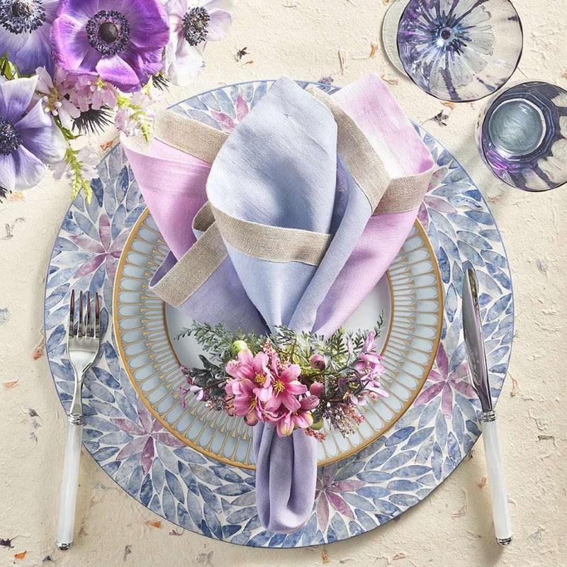 Ombre napkin in lilac and periwinkle by Kim Seybert styled with flowers napkin ring.