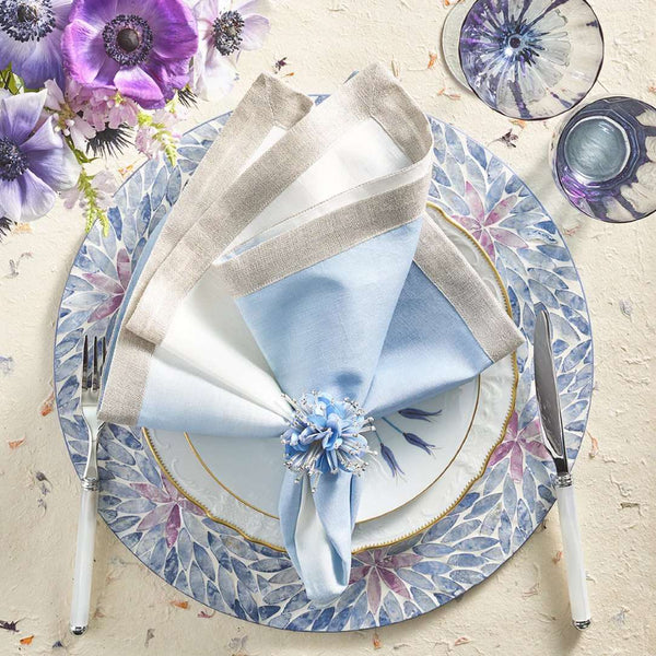 White-to-periwinkle ombré napkin styled on a floral table setting with blue napkin rings, sold at Amiramour