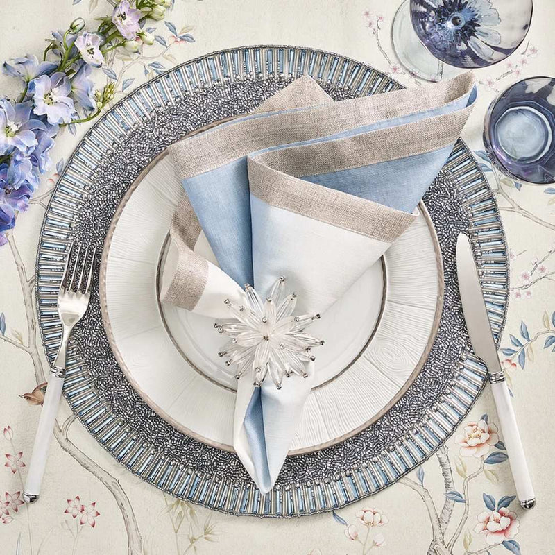 White-to-periwinkle ombré napkin styled on a silver table setting with white napkin rings, sold at Amiramour