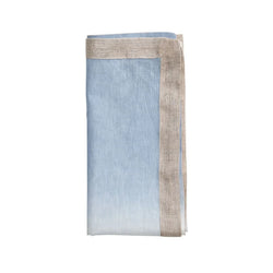 Folded periwinkle and white ombré linen napkin on white background by Kim Seybert, sold on Amirammour