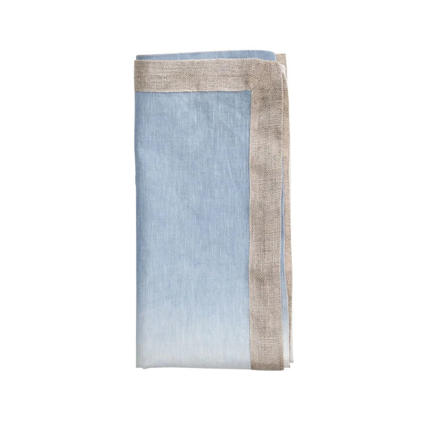 Folded periwinkle and white ombré linen napkin on white background by Kim Seybert, sold on Amirammour