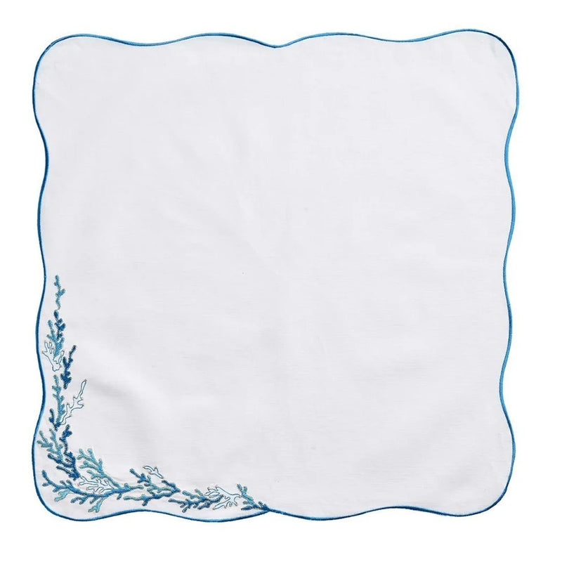 Unfolded Reef napkin in white with embroidered turquoise and gold edge, sold by Amiramour.