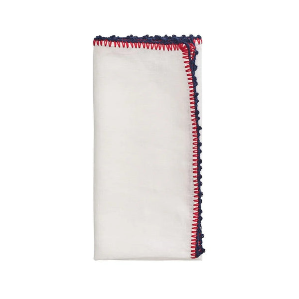 Knotted Edge napkin in white, navy, and red by Kim Seybert on white background, shown by Amiramour