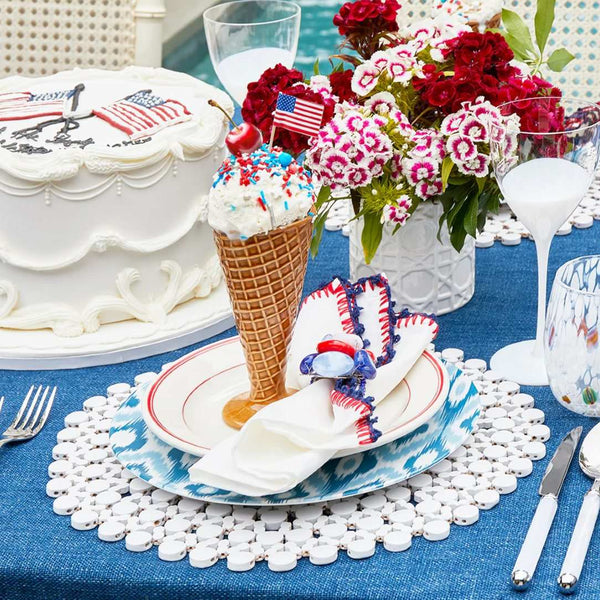 Side view of Knotted Edge napkin on 4th of July cellebration table setting, sold by Amiramour