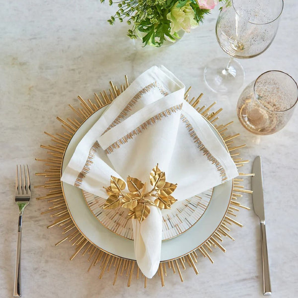 Styled Filament linen napkin in white with gold and silver embroidery by Kim Seybert