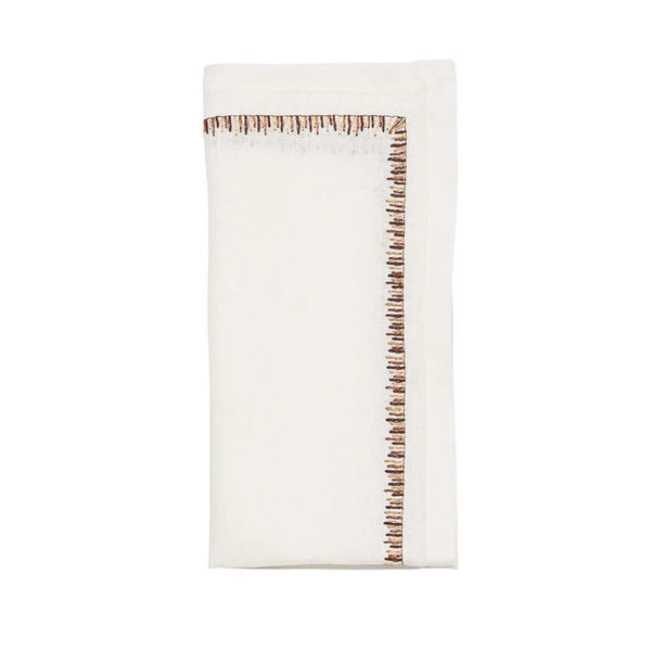 Folded Filament napkin in white with brown embroidery by Kim Seybert, available at Amiramour
