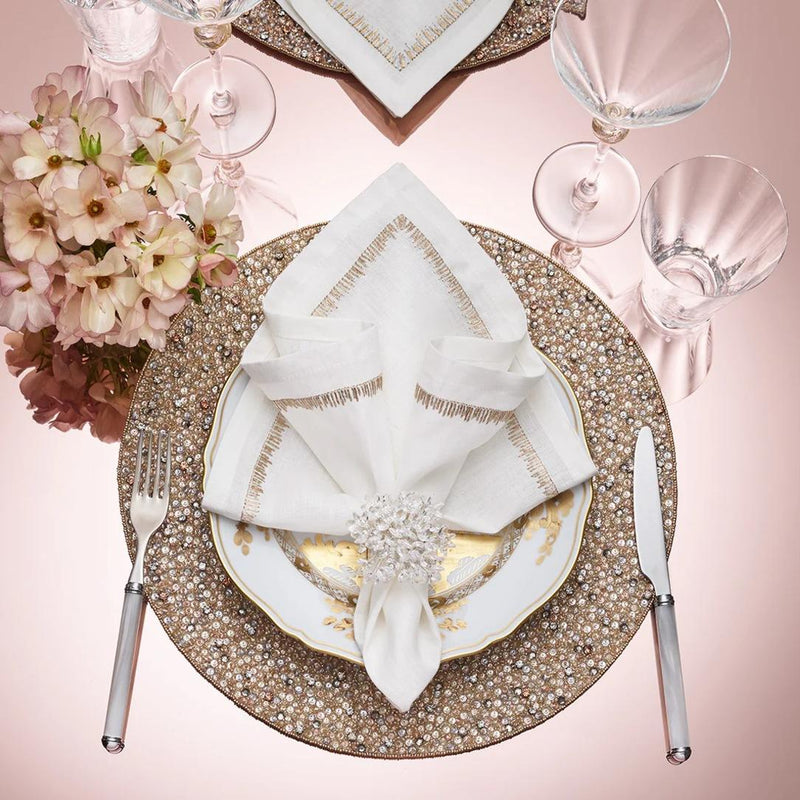 Filament White Linen Napkin with Embroidery by Kim Seybert styled with clear napkin ring