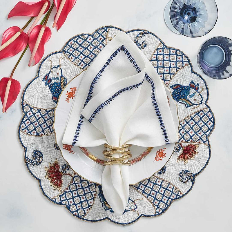 Filament napkin styled with Chinese motif placemat and gold napkin ring, from Amiramour