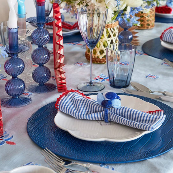 Styled forth of July table setting featuring Seersucker striped napkin by Kim Seybert, sold by Amiramour
