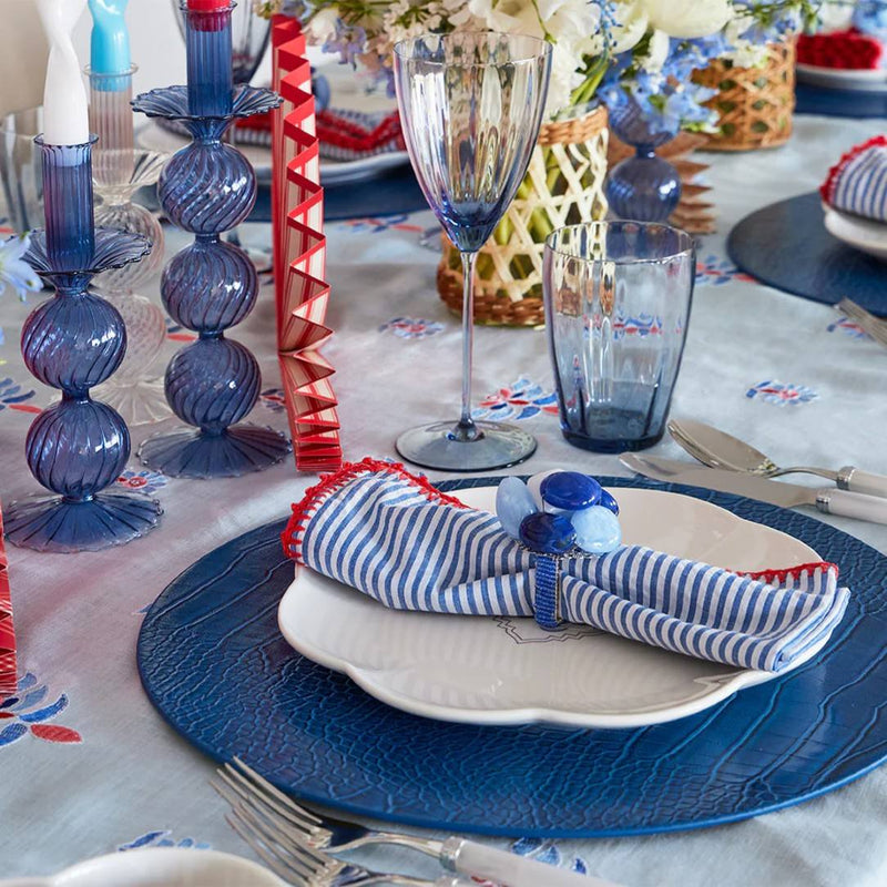Styled forth of July table setting featuring Seersucker striped napkin by Kim Seybert, sold by Amiramour