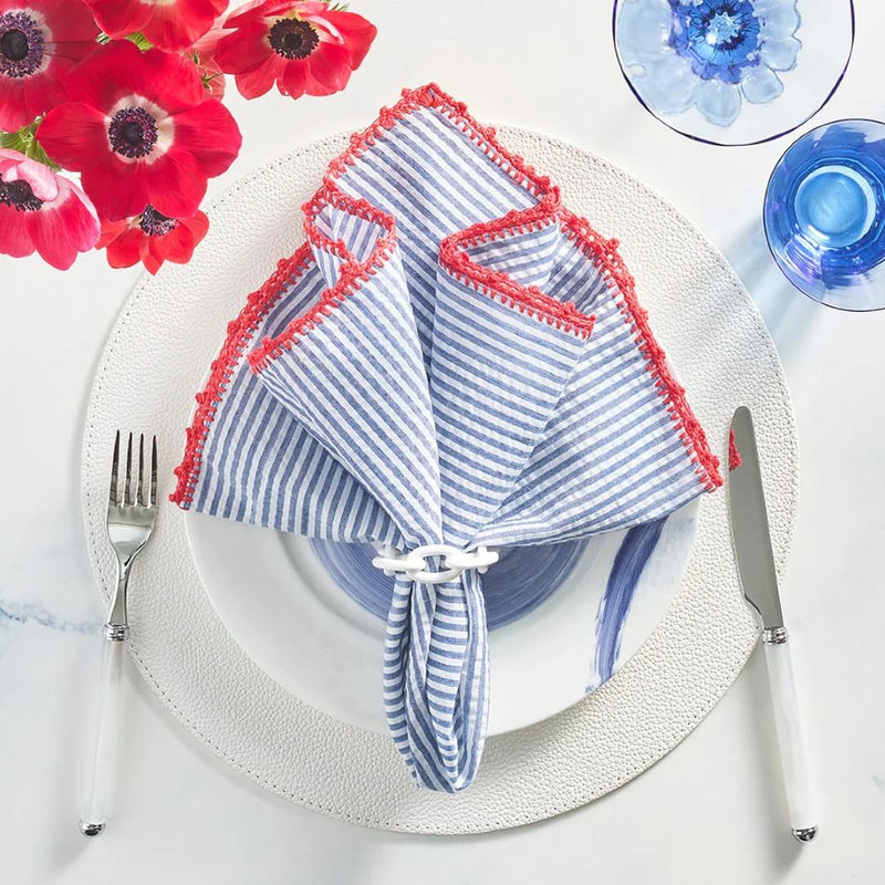 Styled coastal table setting featuring Seersucker striped napkin by Kim Seybert, sold by Amiramour