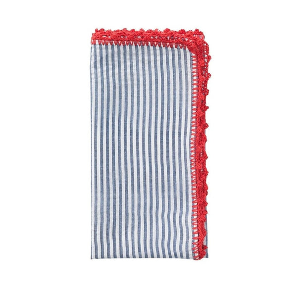 Folded Seersucker napkin in navy and red, highlighting its puckered texture and crocheted edge.