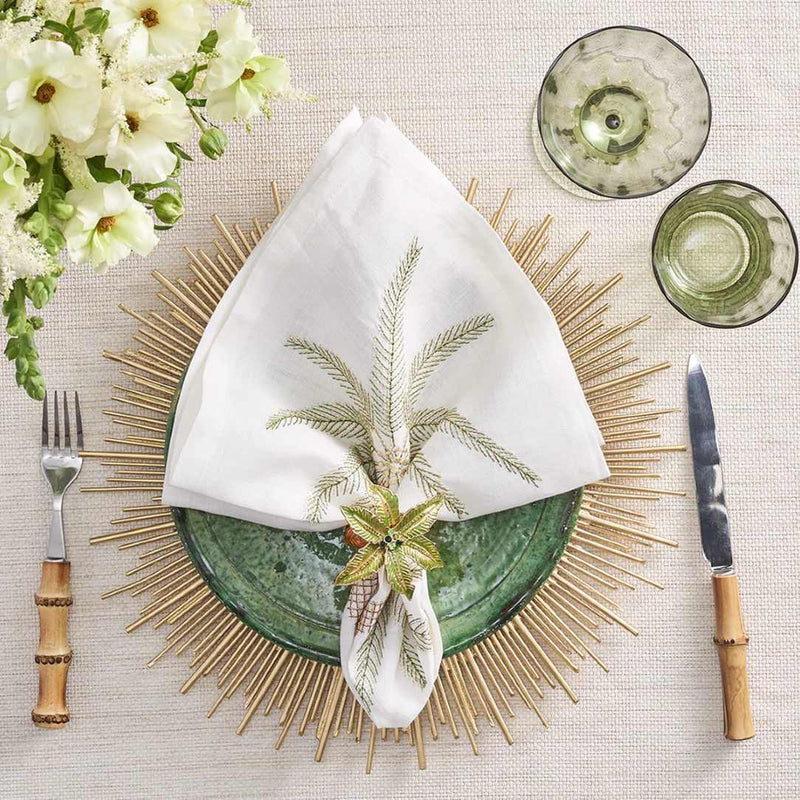 Kim Seybert Palm Coast napkin on a refined seaside table with soft gold and beige accents