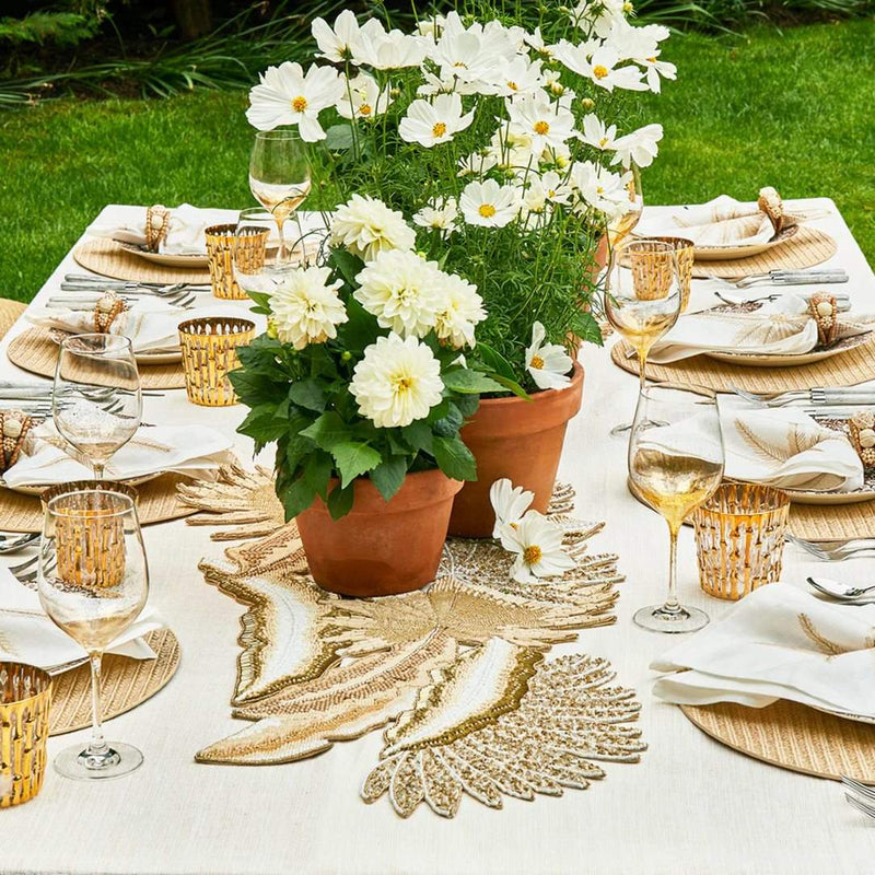 Palm Coast napkin styled on a natural-toned placemat with breezy coastal table decor, shown by Amiramour