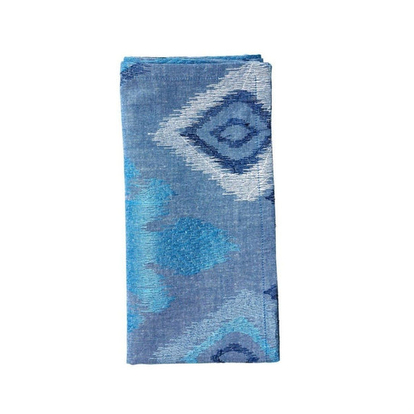 Blue Marrakesh cotton napkin with intricate Inkat embroidery folded on white background, sold at Amiramour.