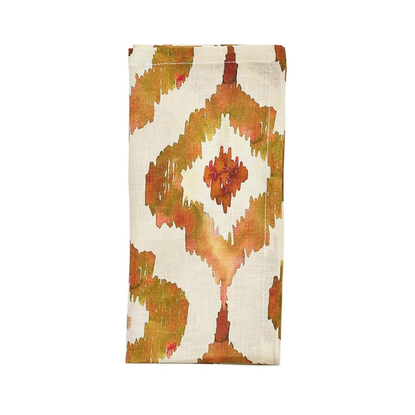 Rust orange Watercolor Ikat napkin by Kim Seybert, neatly folded on a white background, sold at Amiramour