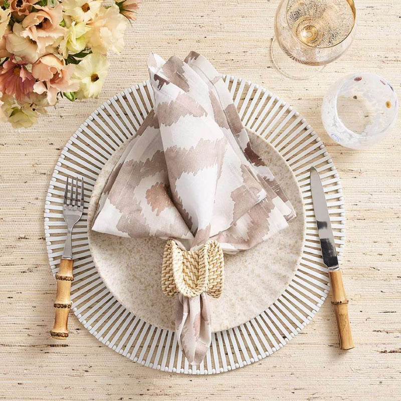 Watercolor Ikat napkin in taupe by Kim Seybert styled in a casual table setting, sold by Amiramour