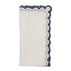 Arches napkin in white and blue by Kim Seybert on white background, shown by Amiramour