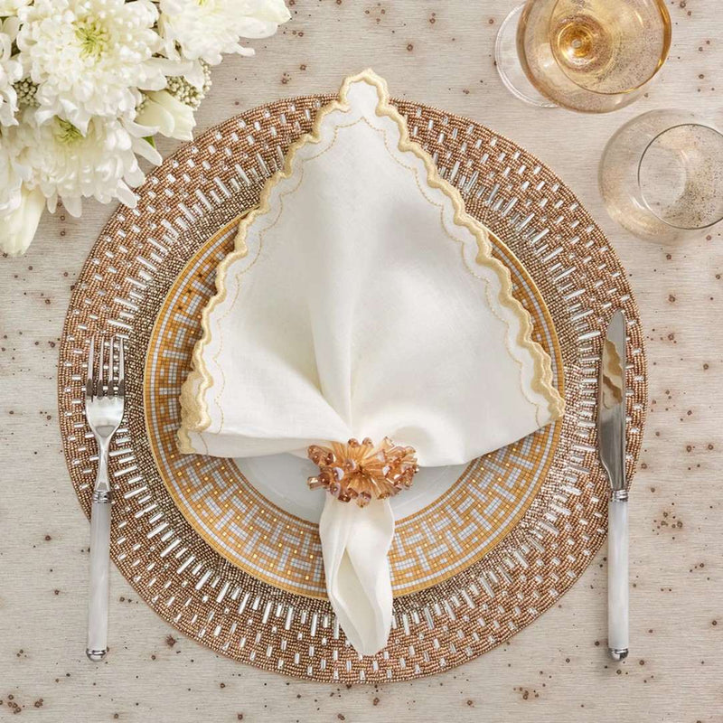 Arches Napkin in White and Gold by Kim Seybert with shiny gold placemat