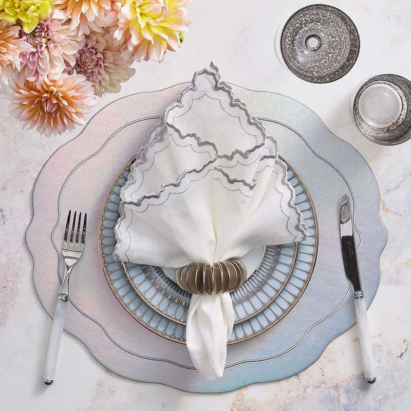 Arches napkin styled with ombré pink and blue placemat and silver napkin ring by Amiramour