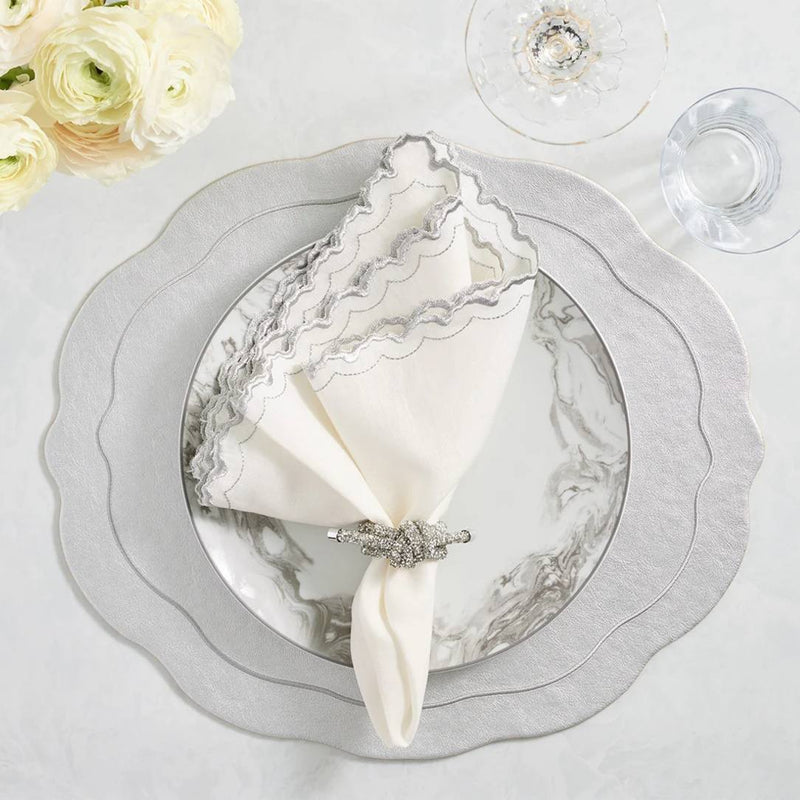 Arches napkin styled with silver placemat and silver napkin rings, top view by Amiramour