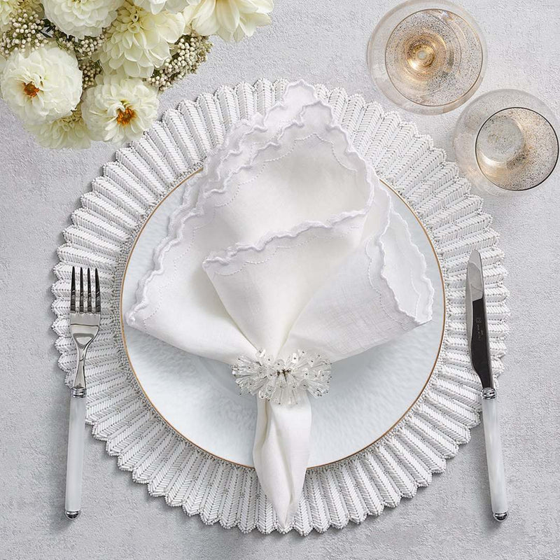 Arches Napkin in White by Kim Seybert styled on white placemat