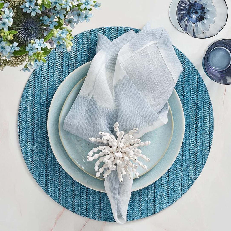 Watercolor stripe napkin in white, blue, and grey tones by Kim Seybert styled with white organic napkin ring