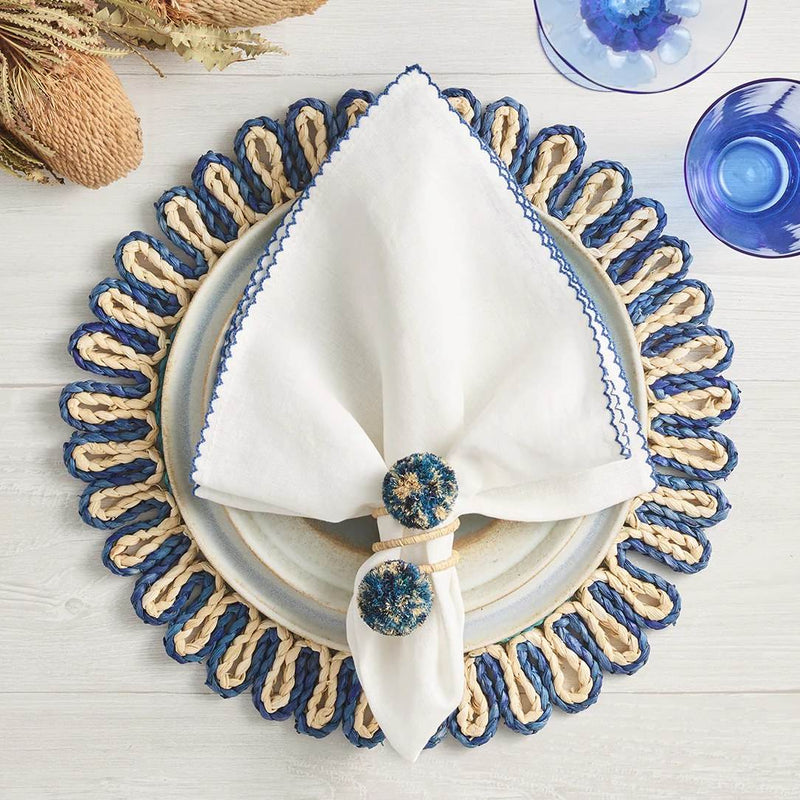 Casbah napkin styled with rattan napkin ring and placemat, casual table at Amiramour