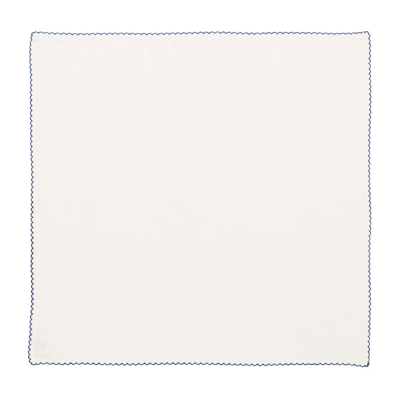 Unwrapped Casbah napkin in white and blue by Kim Seybert on white background, sold by Amiramour