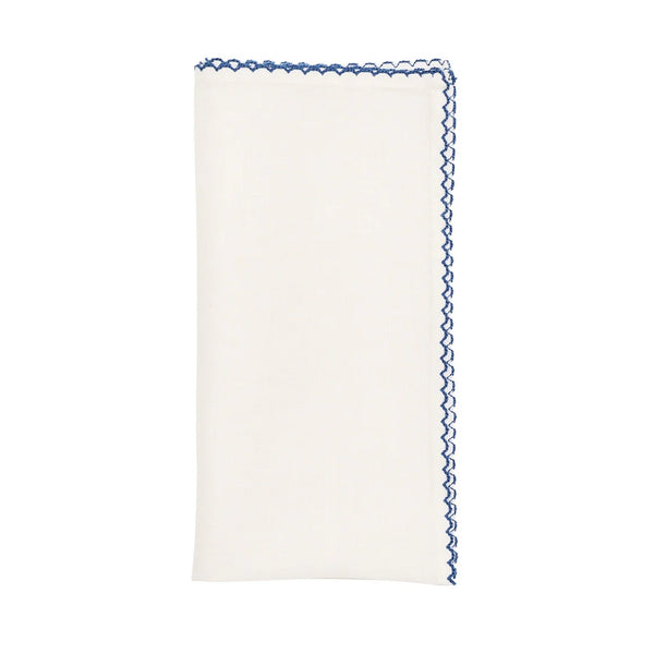 Casbah napkin in white and blue by Kim Seybert on white background, available at Amiramour
