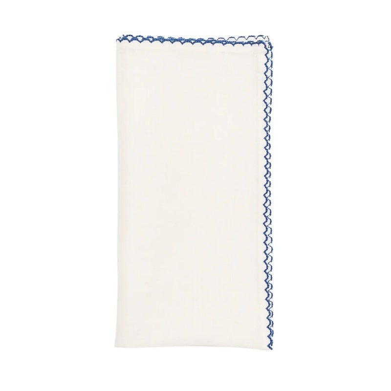Casbah napkin in white and blue by Kim Seybert on white background, available at Amiramour
